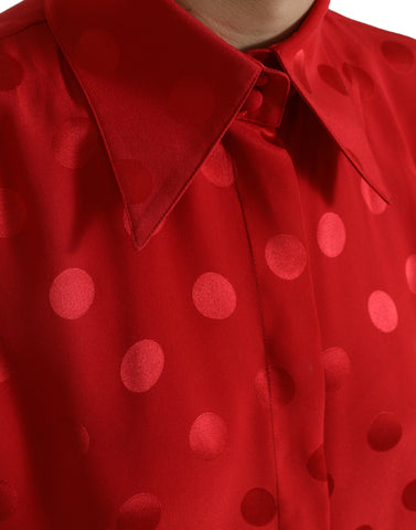Red polka dot sleeveless collared blouse top by Dolce & Gabbana, featuring a stylish design with a classic collar and vibrant pattern.