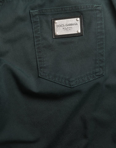 Green cotton stretch skinny men's denim jeans by Dolce & Gabbana displayed on a hanger