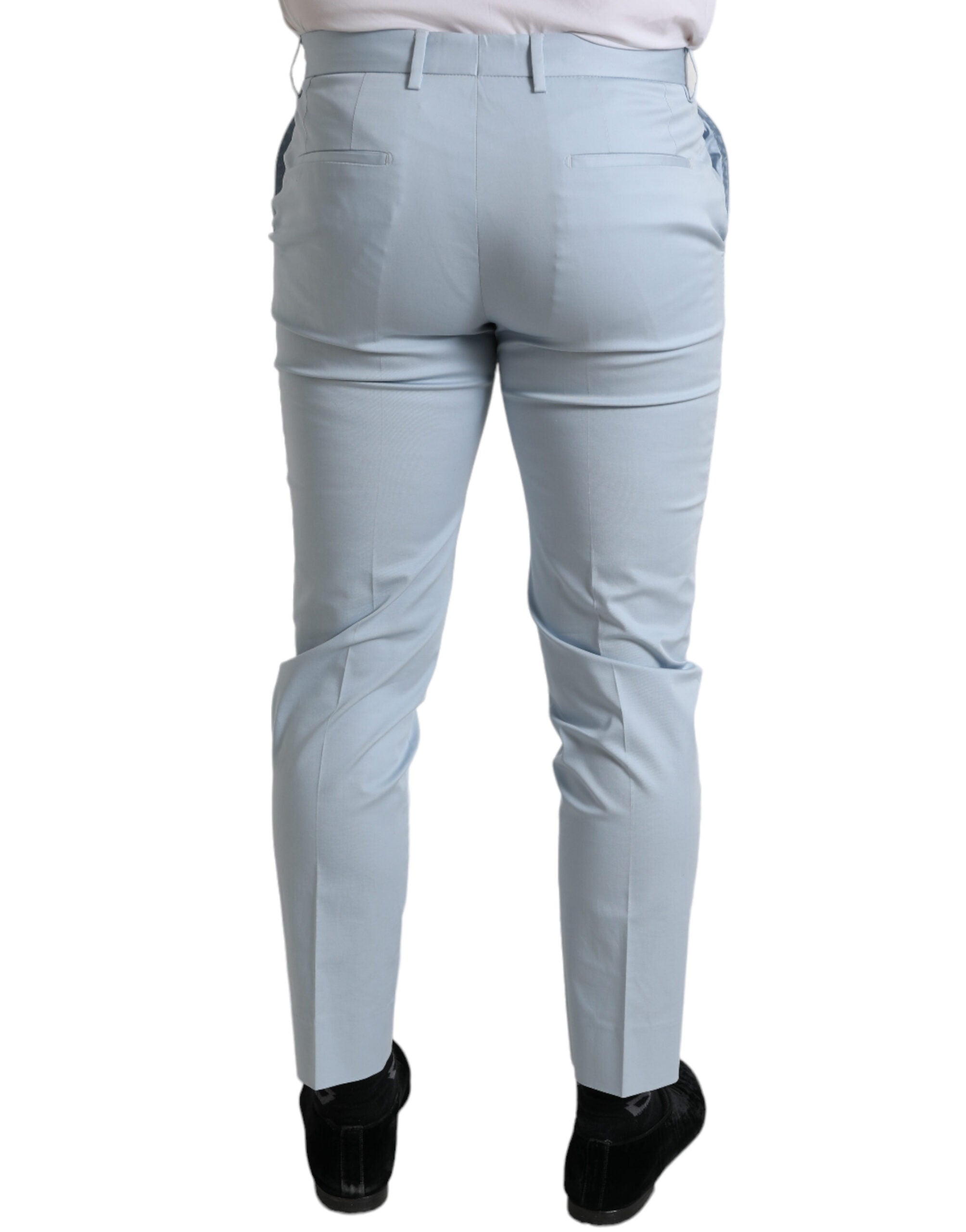 Sky blue cotton stretch skinny pants by Dolce & Gabbana, close-up of fitted pants with waistband and stitching details.
