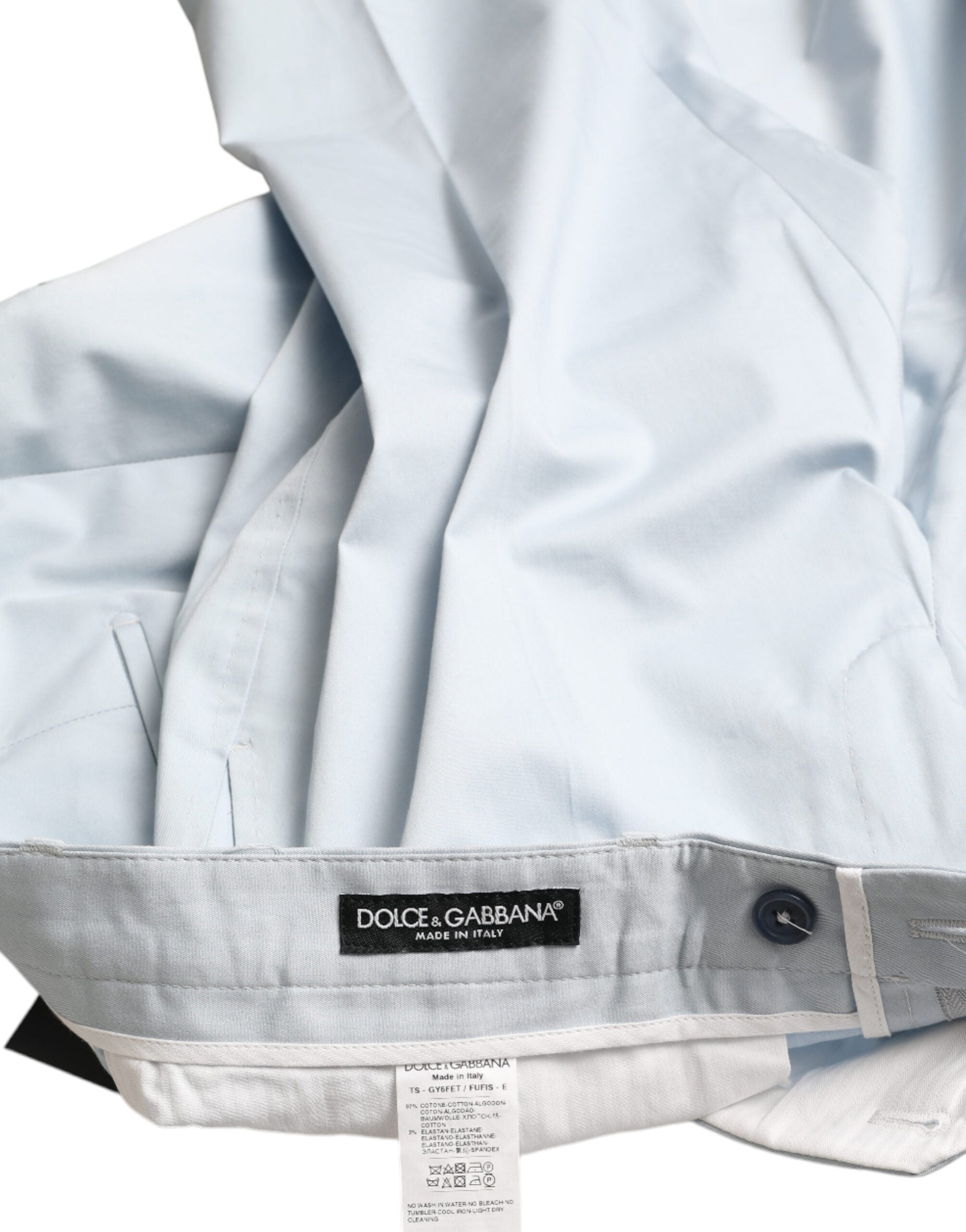 Sky blue cotton stretch skinny pants by Dolce & Gabbana, close-up view showing fitted design and smooth fabric texture.