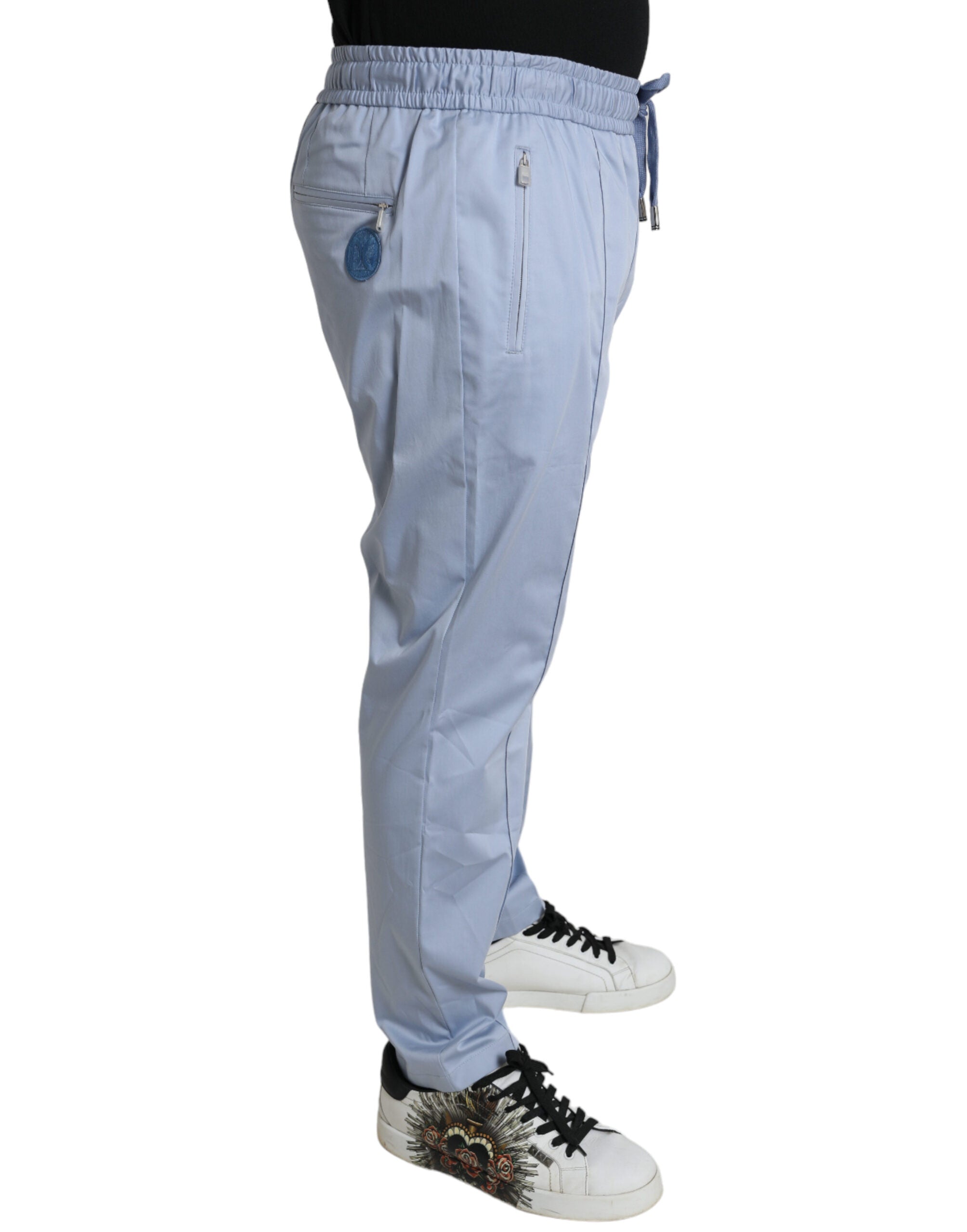Light blue cotton stretch jogger pants by Dolce & Gabbana featuring an elastic waistband and tapered fit.