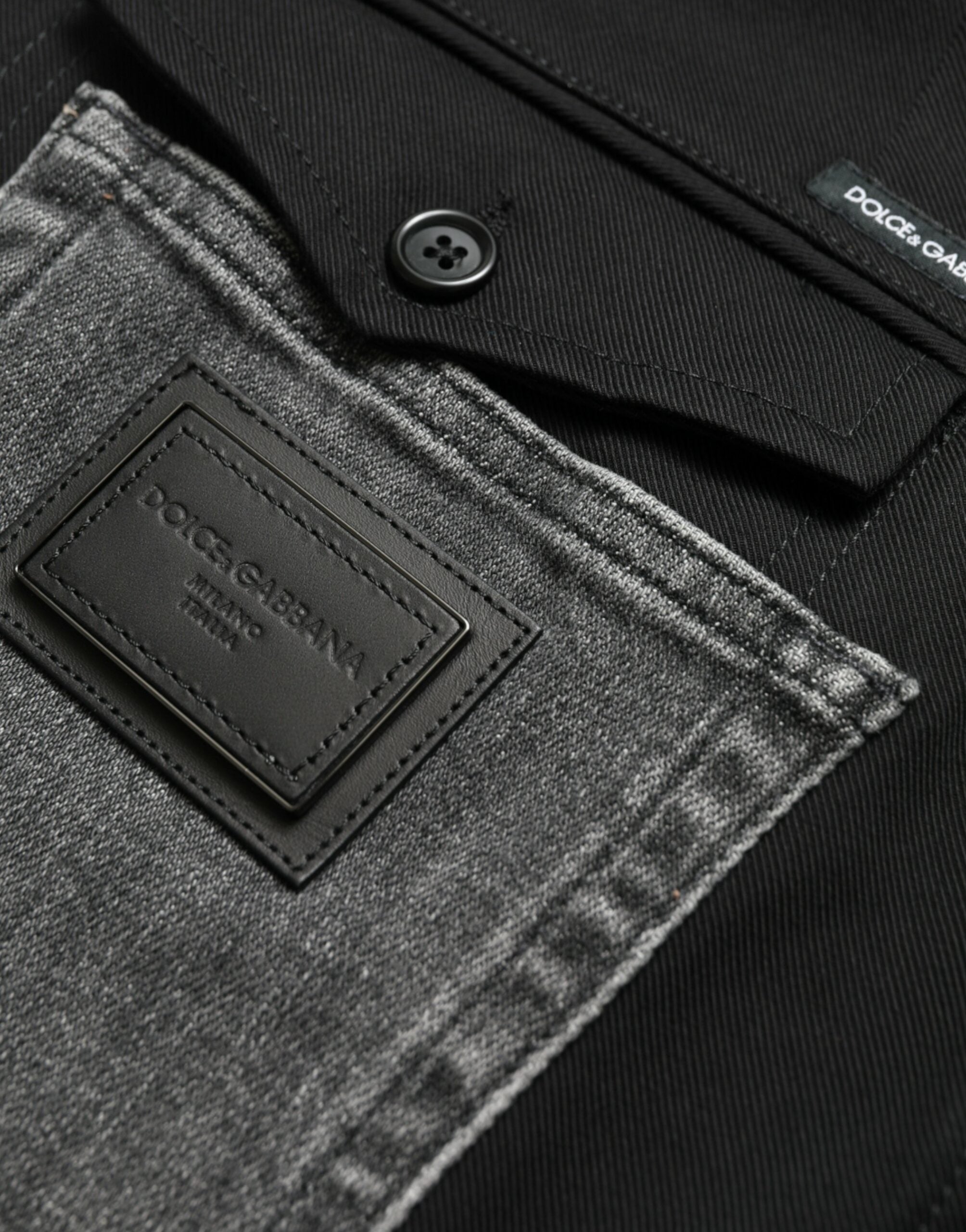 Black and gray slim cotton denim jeans pants by Dolce & Gabbana, shown with a close-up of the fabric and fit.