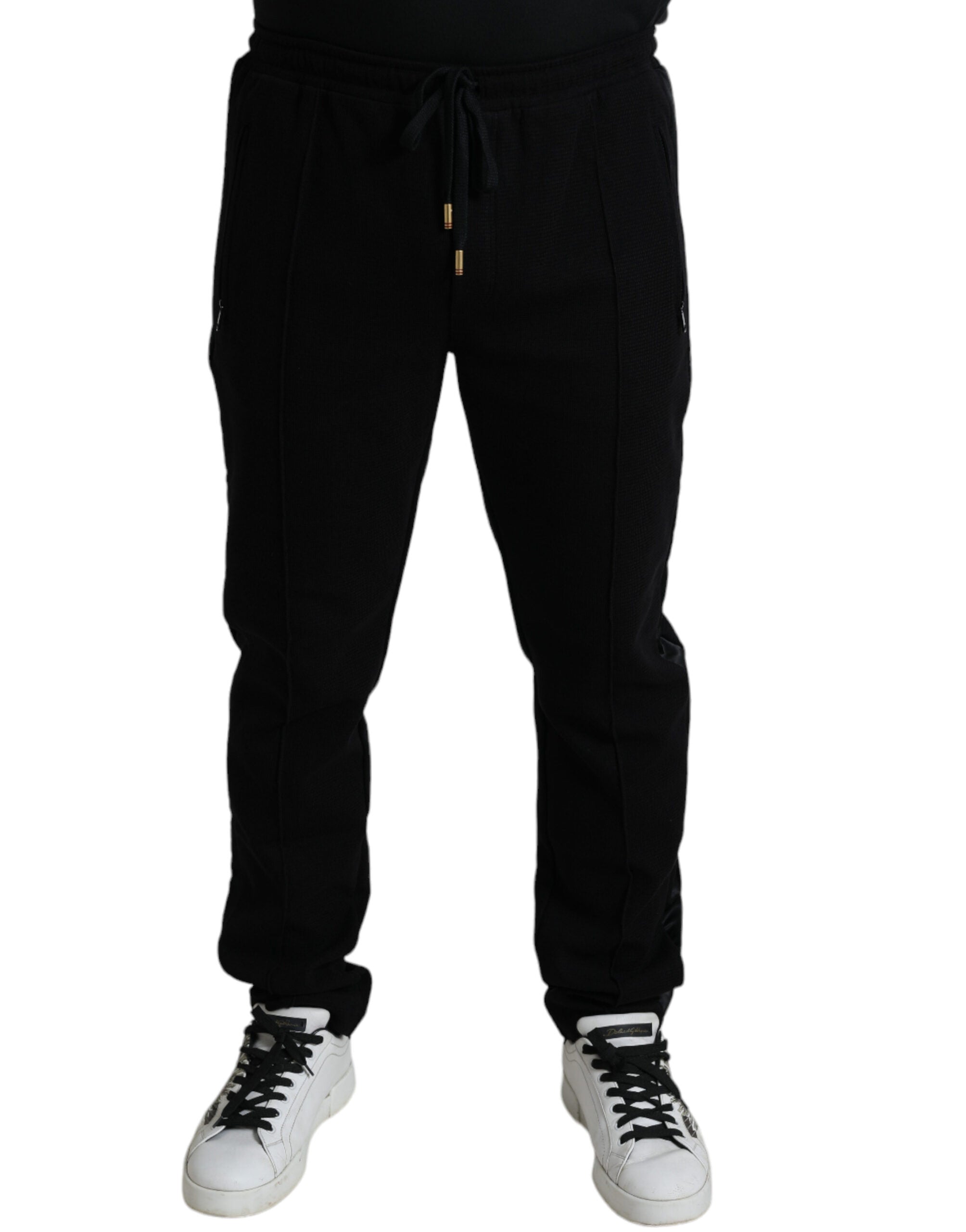 Black cotton skinny jogger sweatpants by Dolce & Gabbana, featuring a tapered fit and casual drawstring waist.