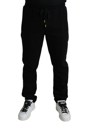 Black cotton skinny jogger sweatpants by Dolce & Gabbana, featuring a tapered fit and casual drawstring waist.
