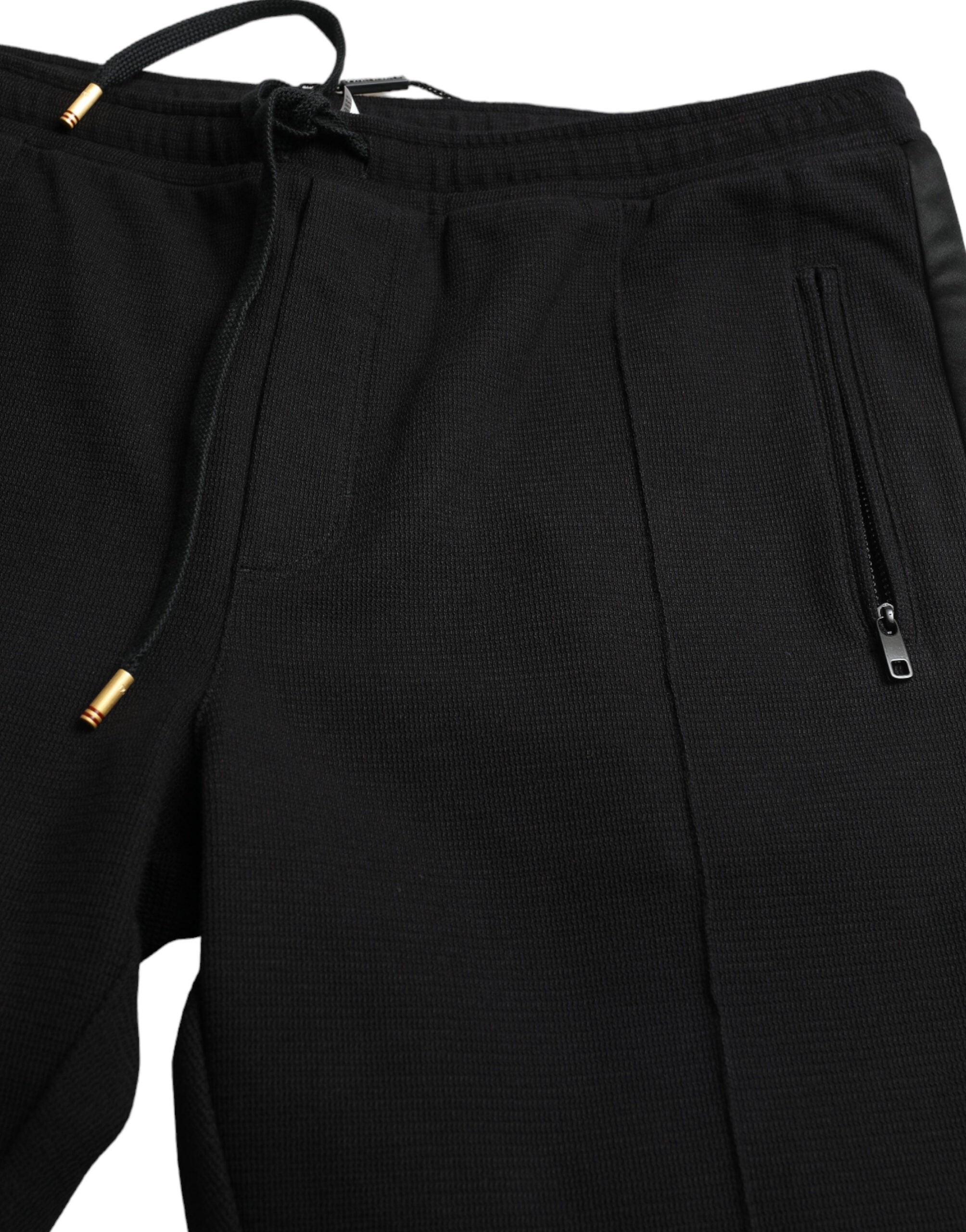 Black cotton skinny jogger sweatpants by Dolce & Gabbana with elastic waistband and tapered fit, casual and stylish for everyday wear.