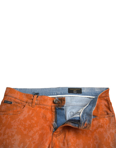 Dolce & Gabbana multicolor ombre cotton slim fit denim jeans laid flat showing the vibrant color gradient and classic denim details.