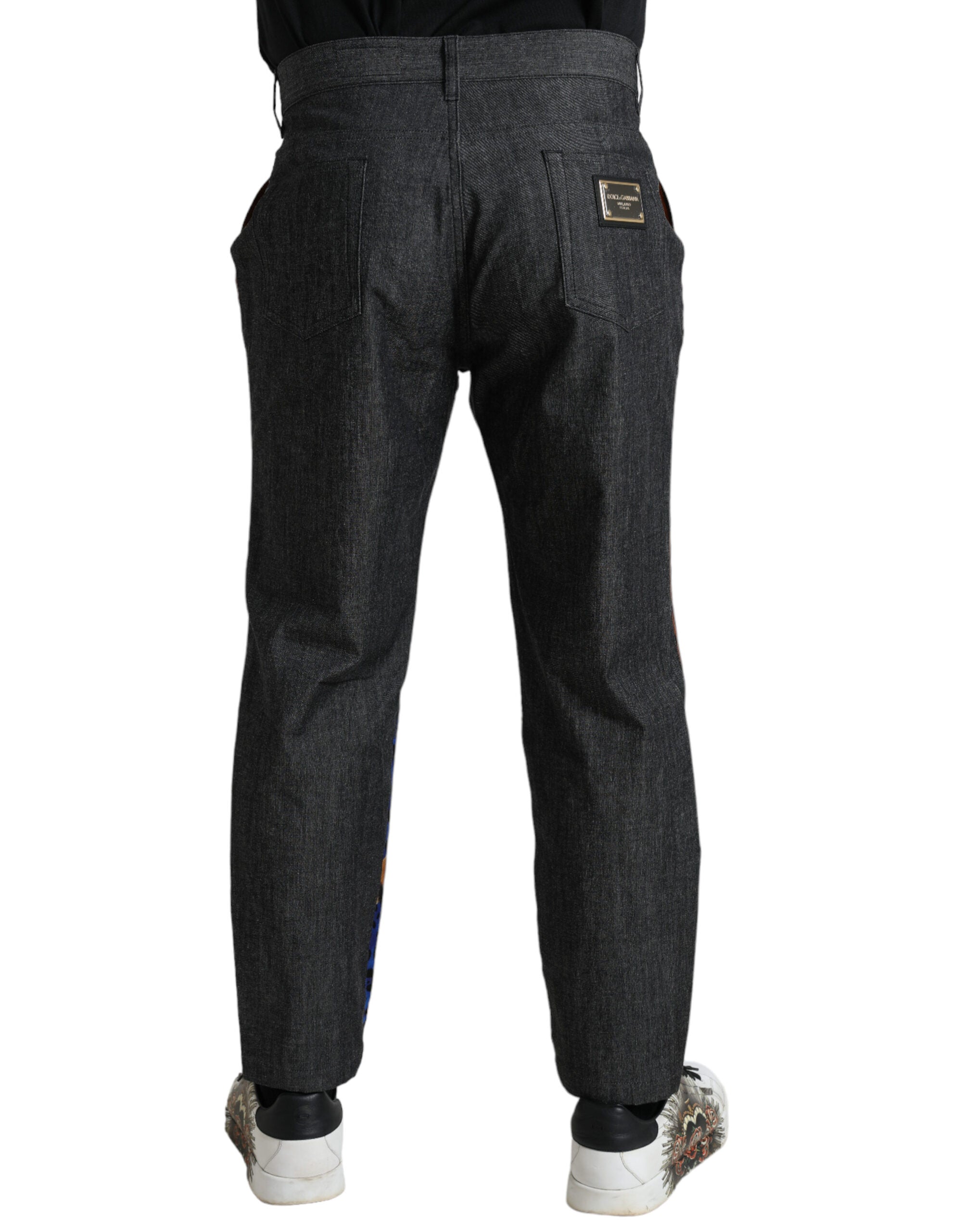 Multicolor tiger print cotton loose denim jeans by Dolce & Gabbana displayed on a hanger.