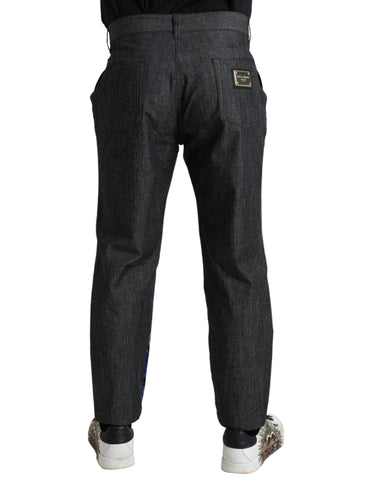 Multicolor tiger print cotton loose denim jeans by Dolce & Gabbana displayed on a hanger.