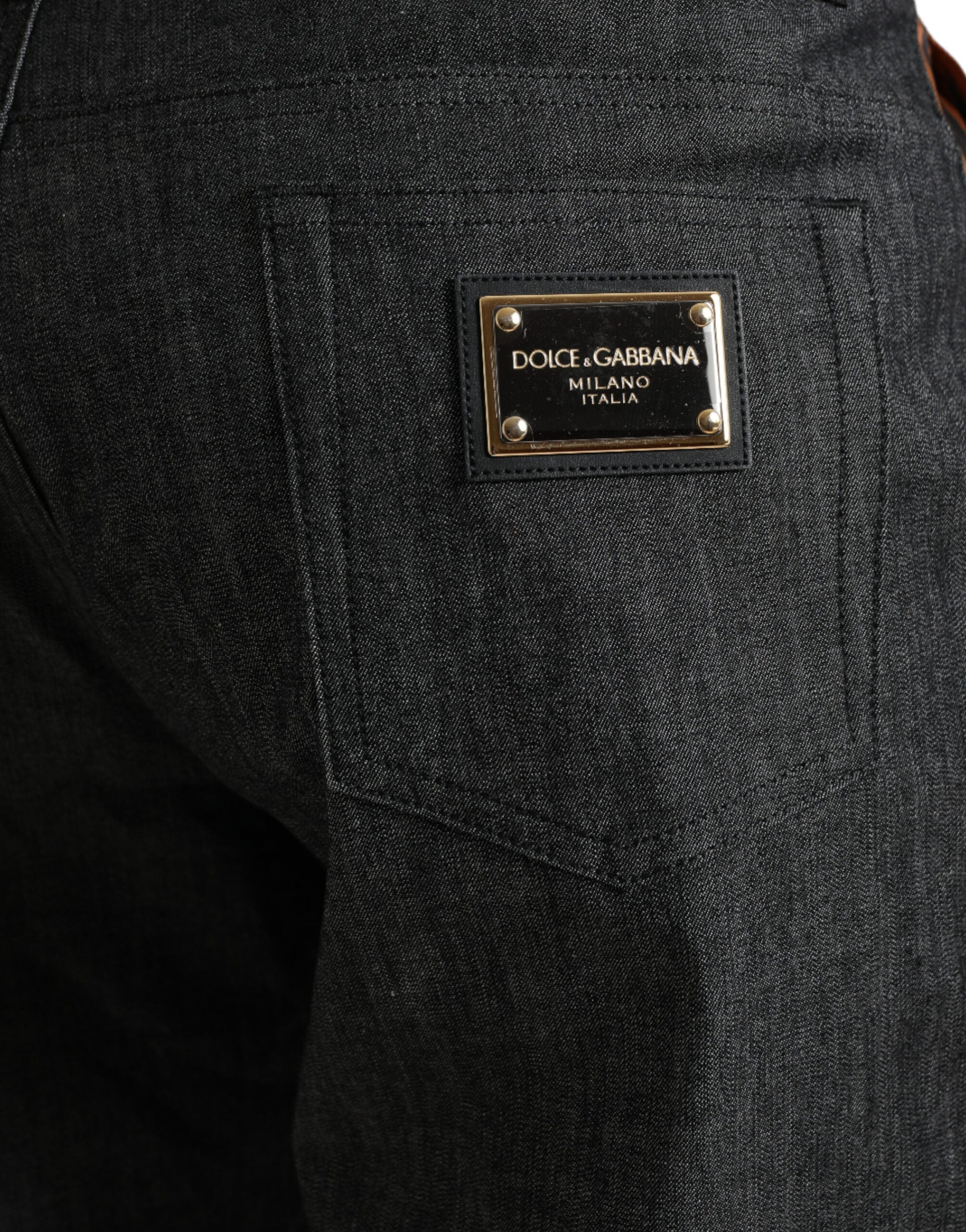 Multicolor tiger print cotton loose denim jeans by Dolce & Gabbana, featuring bold tiger pattern and relaxed fit.