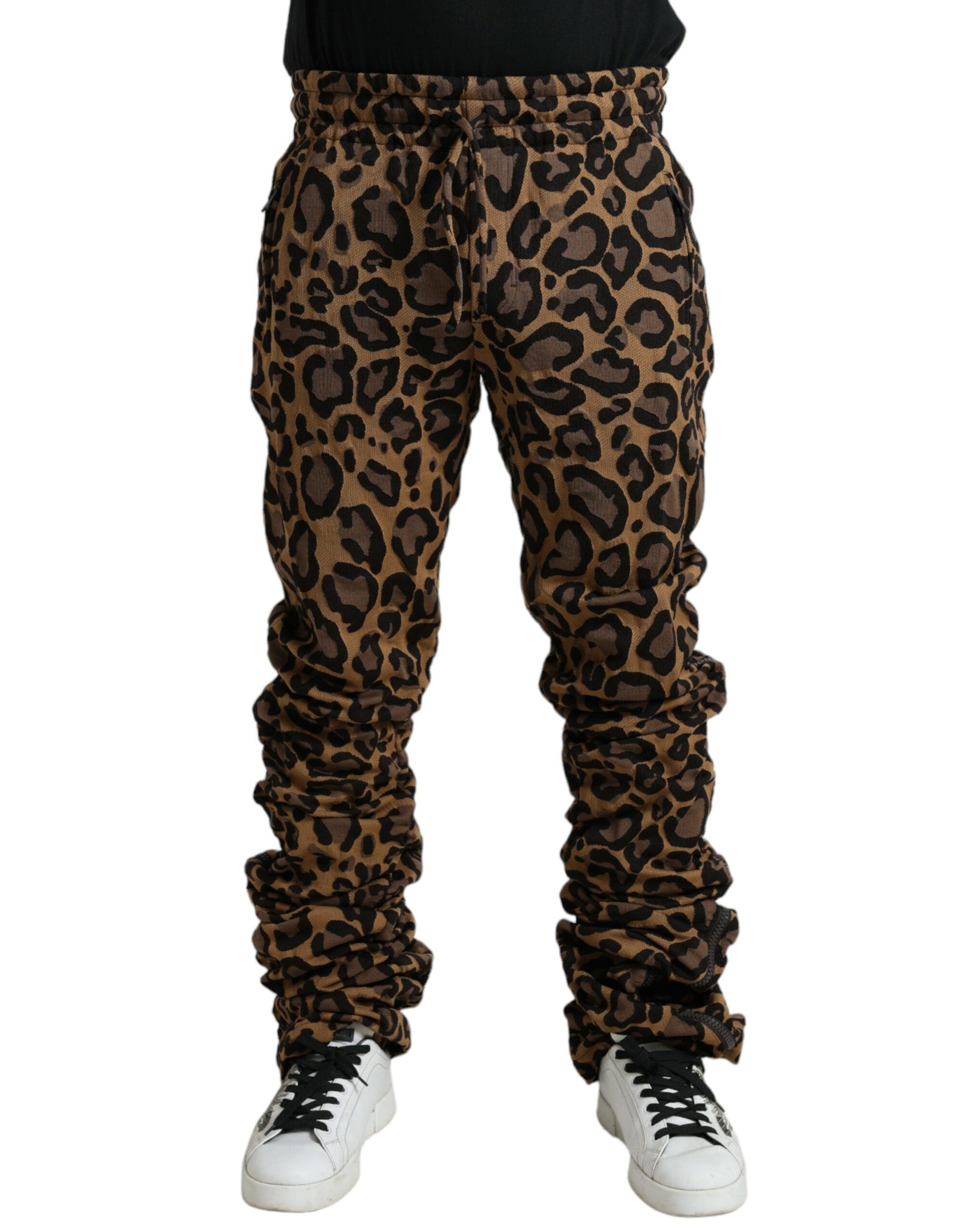 Brown leopard jacquard jogger pants by Dolce & Gabbana with elastic waistband and tapered fit, shown on a model.