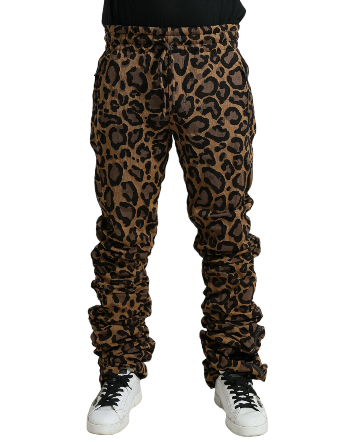 Brown leopard jacquard jogger pants by Dolce & Gabbana with elastic waistband and tapered fit, shown on a model.