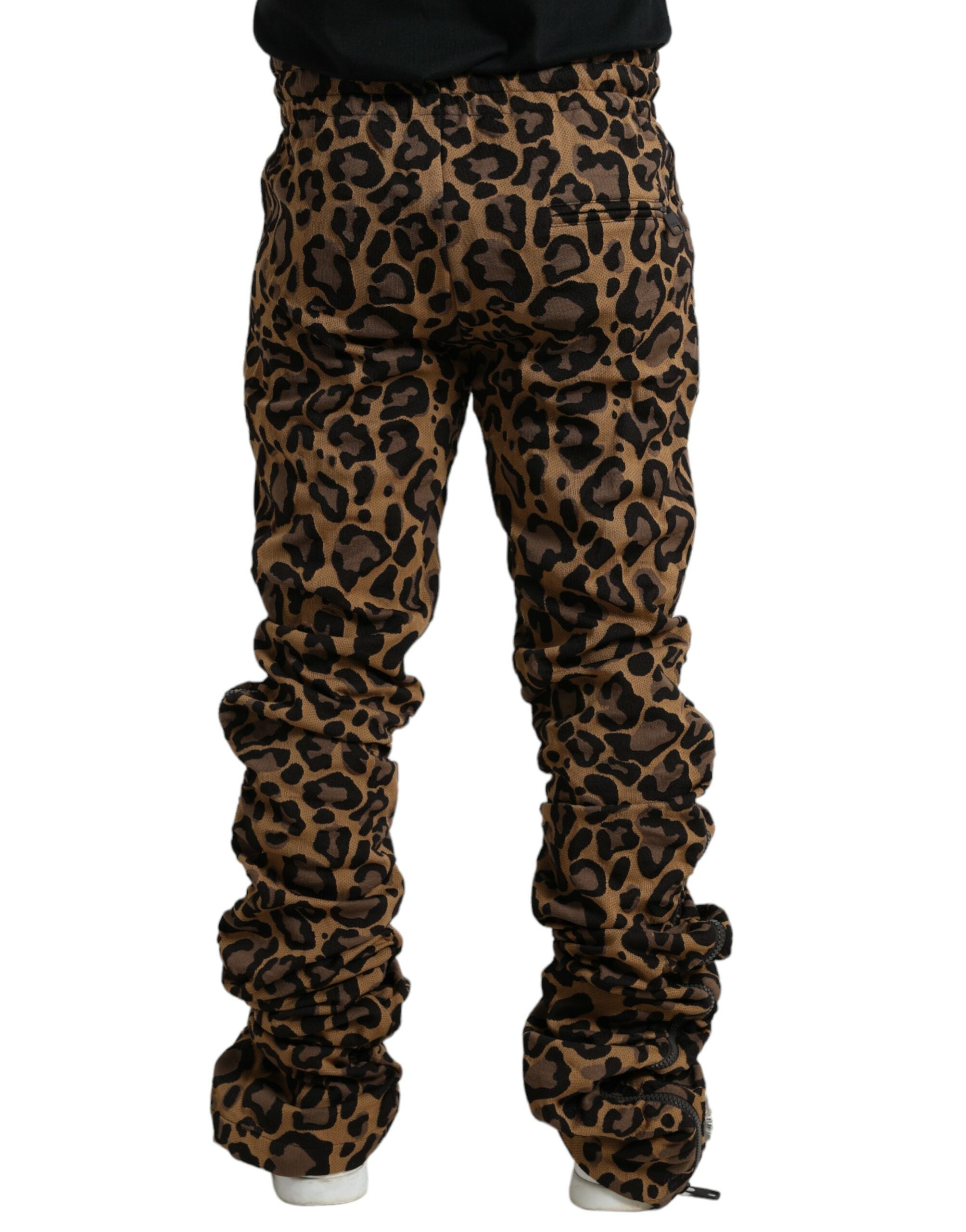 Brown leopard jacquard jogger pants by Dolce & Gabbana featuring an elastic waistband and tapered fit.