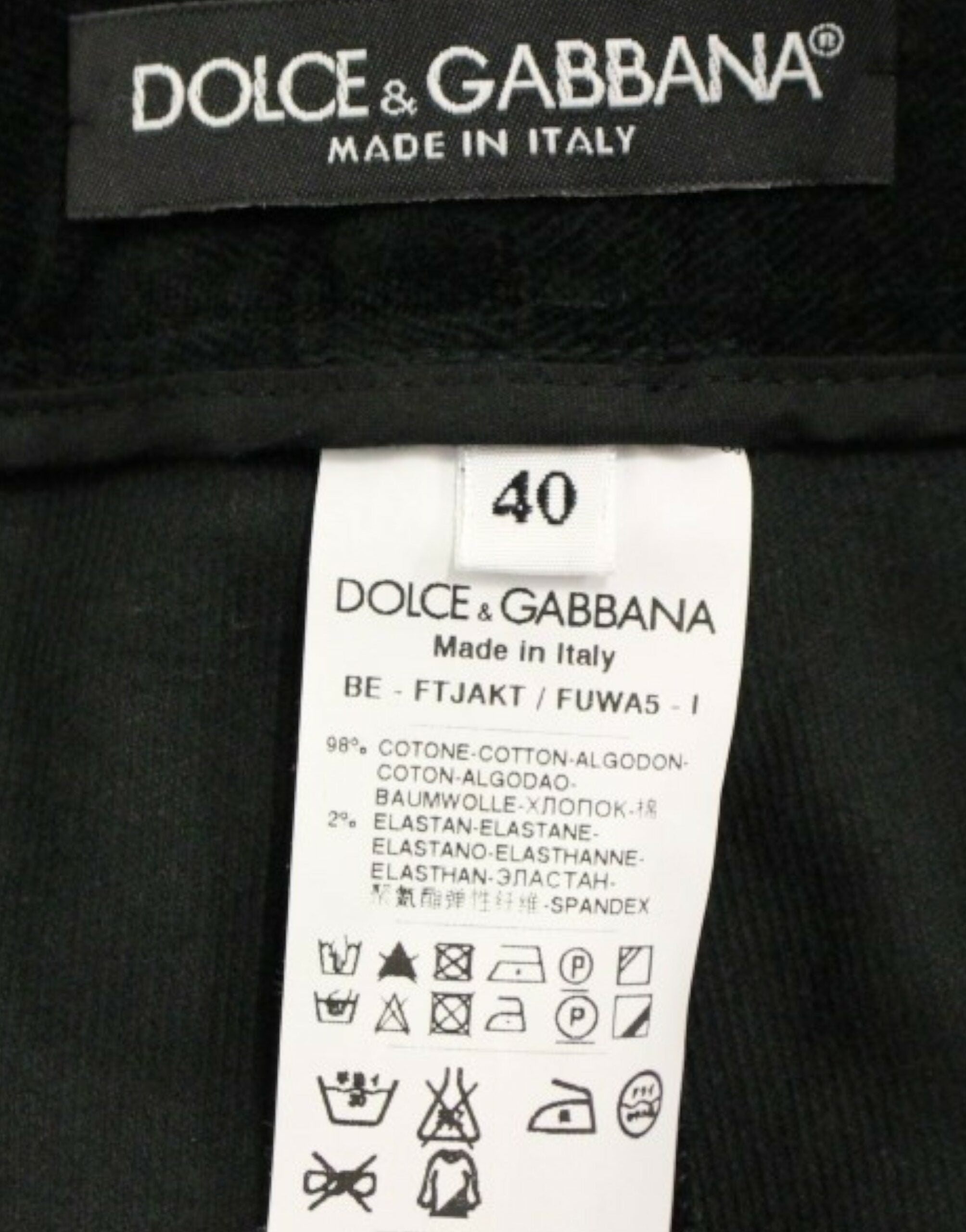 Dark green cotton shorts pants by Dolce & Gabbana, featuring a relaxed fit and classic design, shown on a plain background.