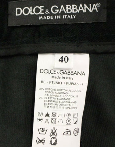 Dark green cotton shorts pants by Dolce & Gabbana, featuring a relaxed fit and classic design, shown on a plain background.