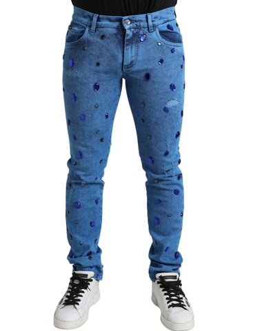 Blue crystal-embellished skinny denim jeans by Dolce & Gabbana, showcasing fitted style and detailed crystal accents.