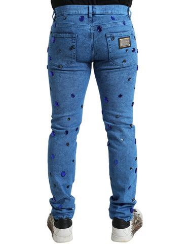 Blue crystal-embellished skinny denim jeans by Dolce & Gabbana, featuring fitted design and decorative crystal details.