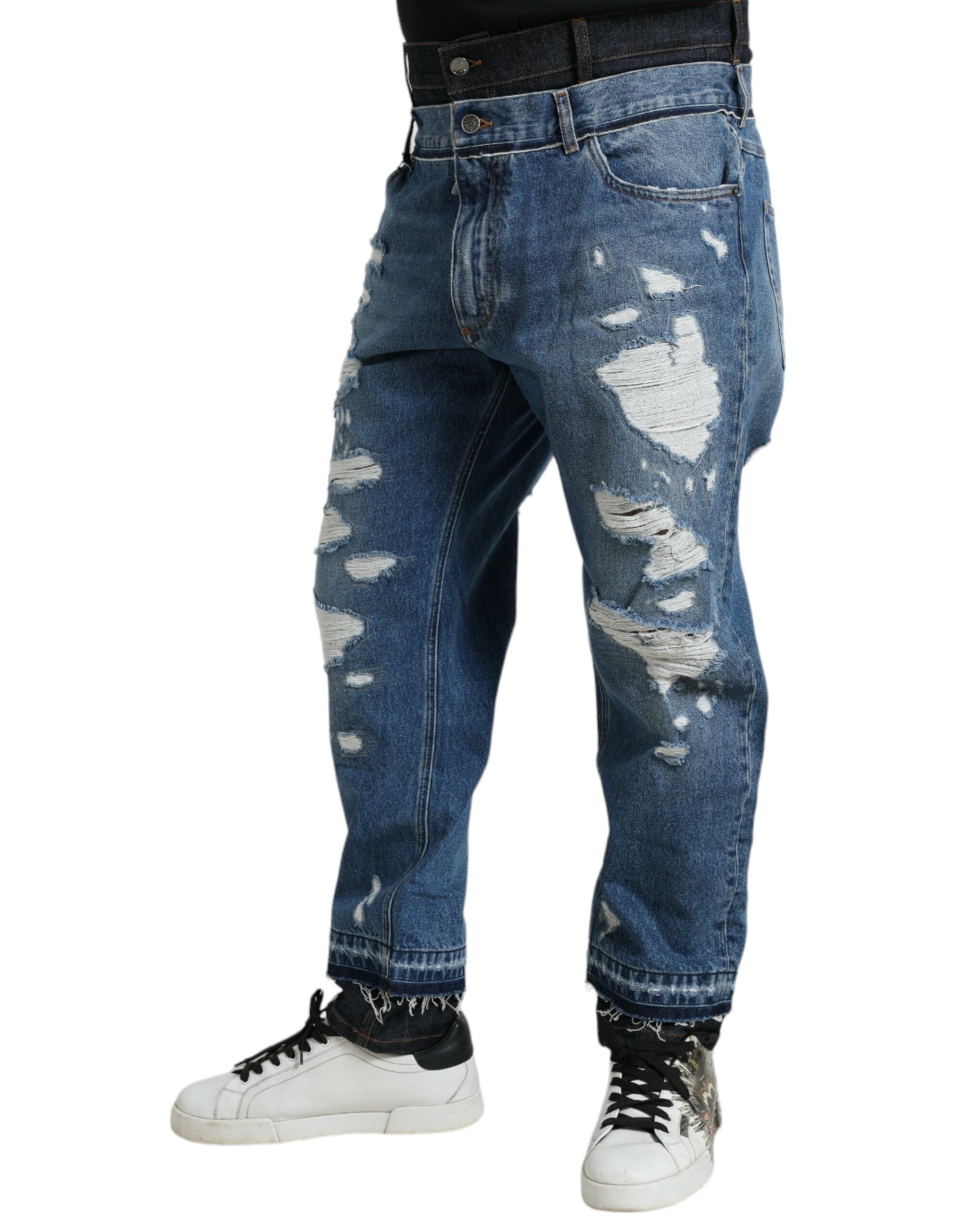 Blue tattered cotton denim jeans for men by Dolce & Gabbana, featuring distressed details and classic fit.