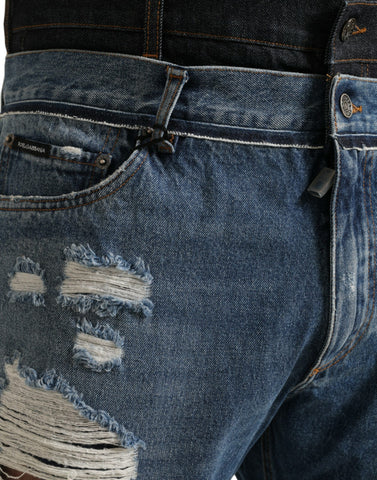 Blue tattered cotton denim jeans for men by Dolce & Gabbana, featuring distressed details and classic fit.