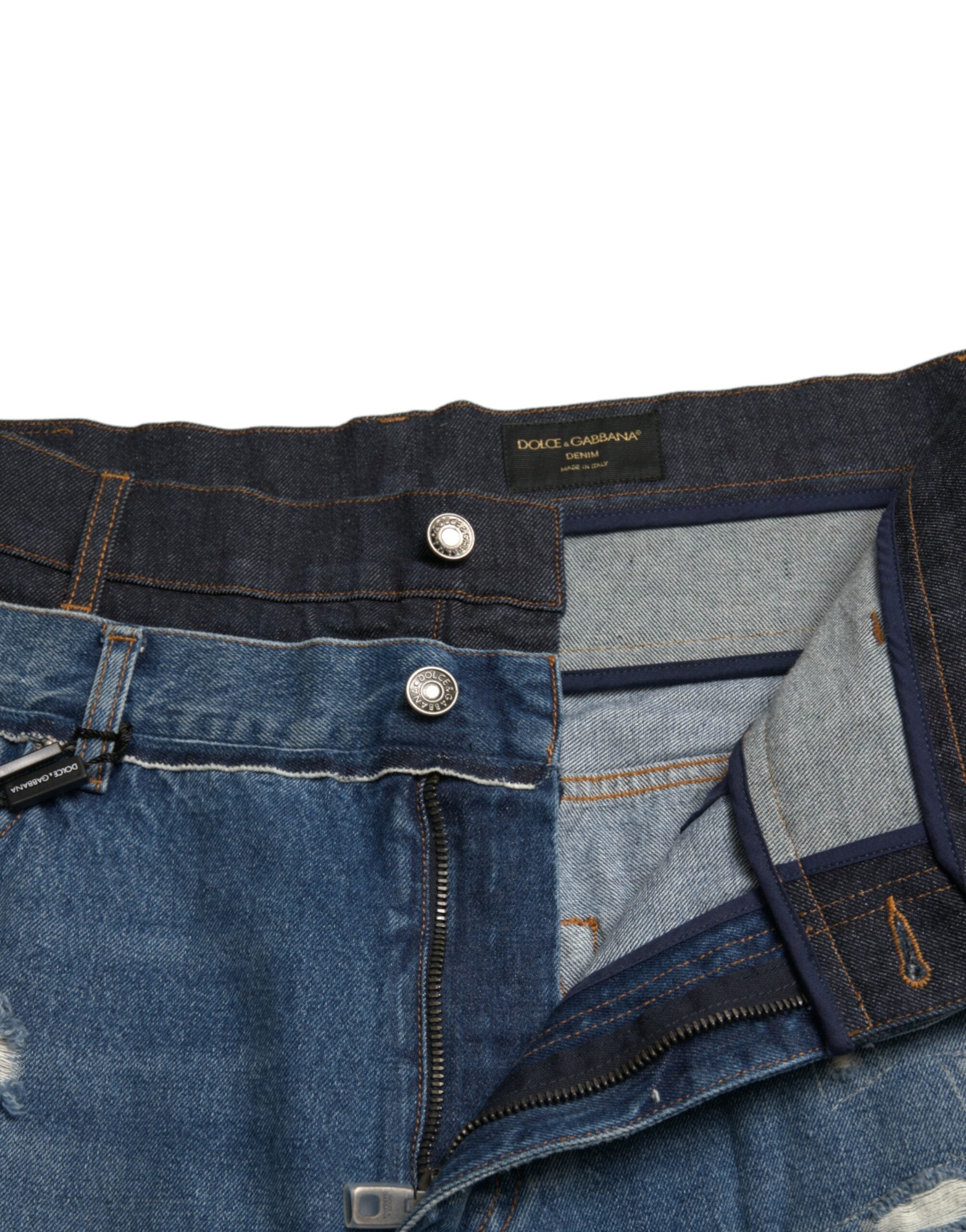 Blue tattered cotton denim jeans for men by Dolce & Gabbana, showing distressed details and classic fit.