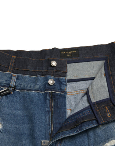 Blue tattered cotton denim jeans for men by Dolce & Gabbana, showing distressed details and classic fit.