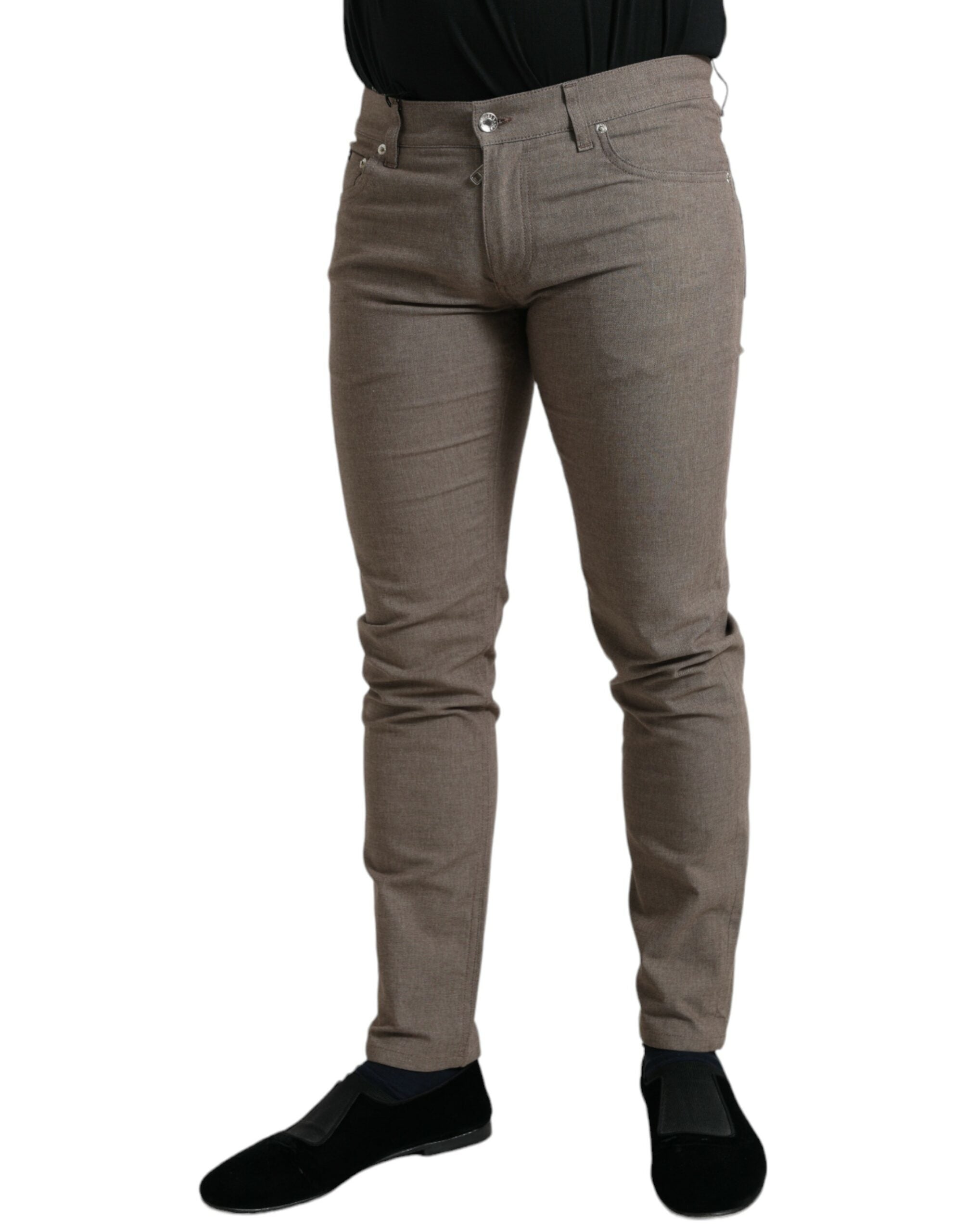 Brown cotton stretch skinny men's pants by Dolce & Gabbana, showing close-up view of fitted design and fabric texture.