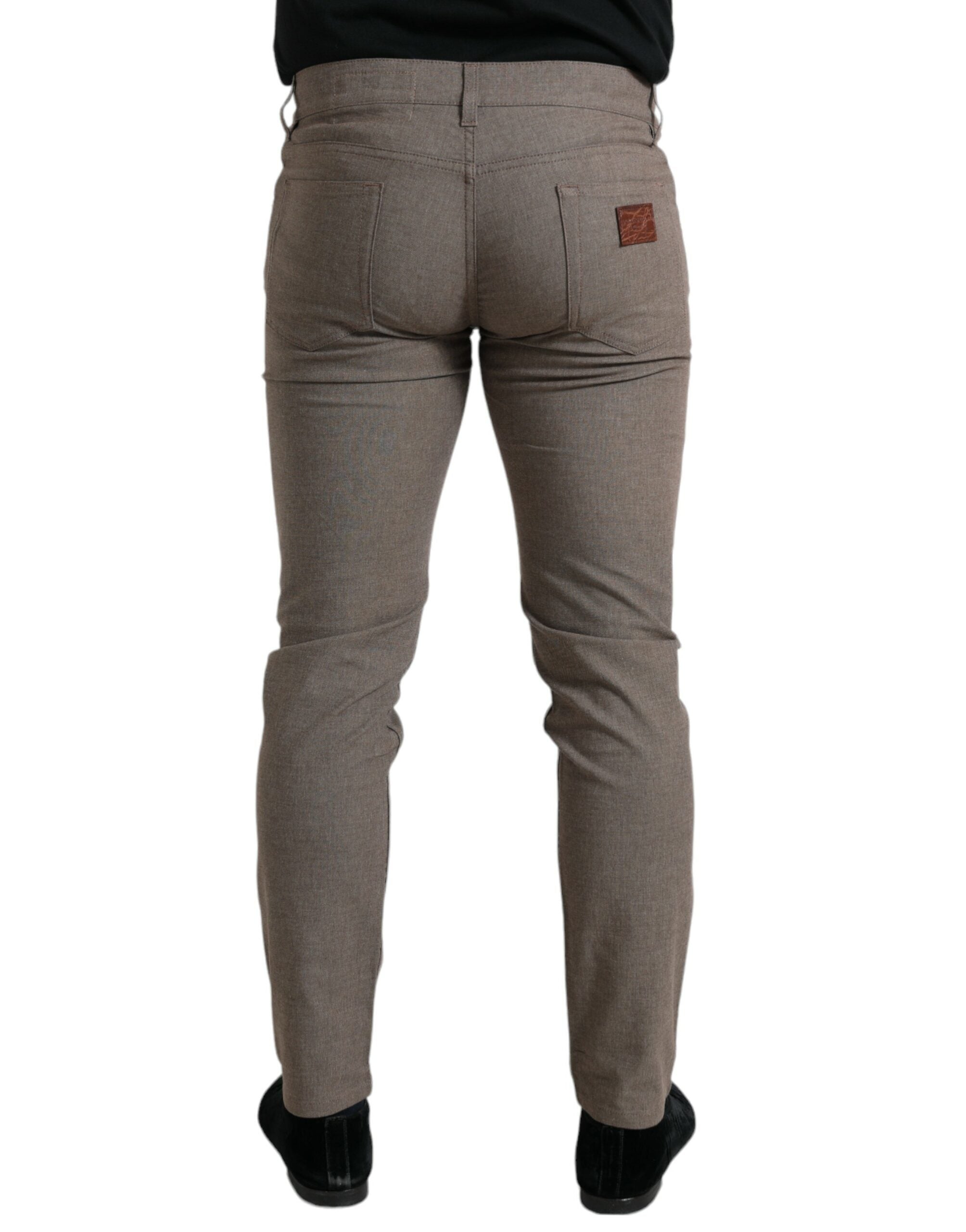 Brown cotton stretch skinny men's pants by Dolce & Gabbana shown in the image.