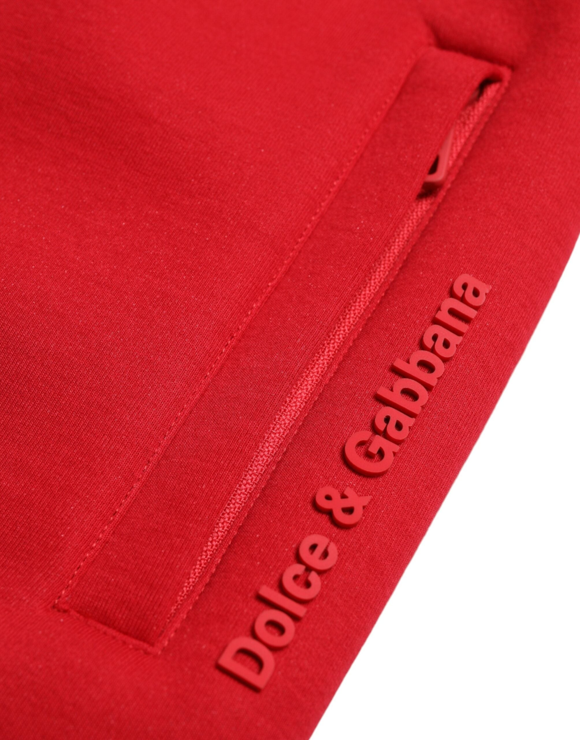 Red cotton blend skinny jogger pants by Dolce & Gabbana, showing a close-up of the stylish, fitted waistband and fabric texture.