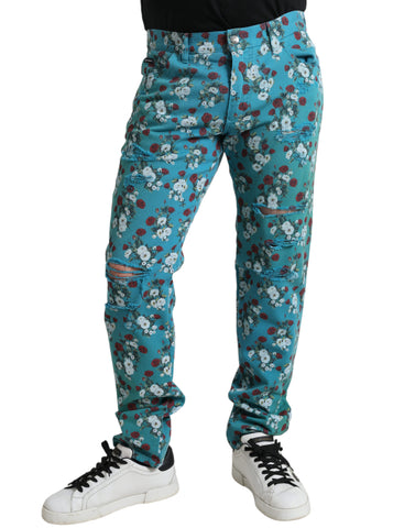 Blue floral print skinny cotton denim pants by Dolce & Gabbana, showing detailed floral design and fitted style.
