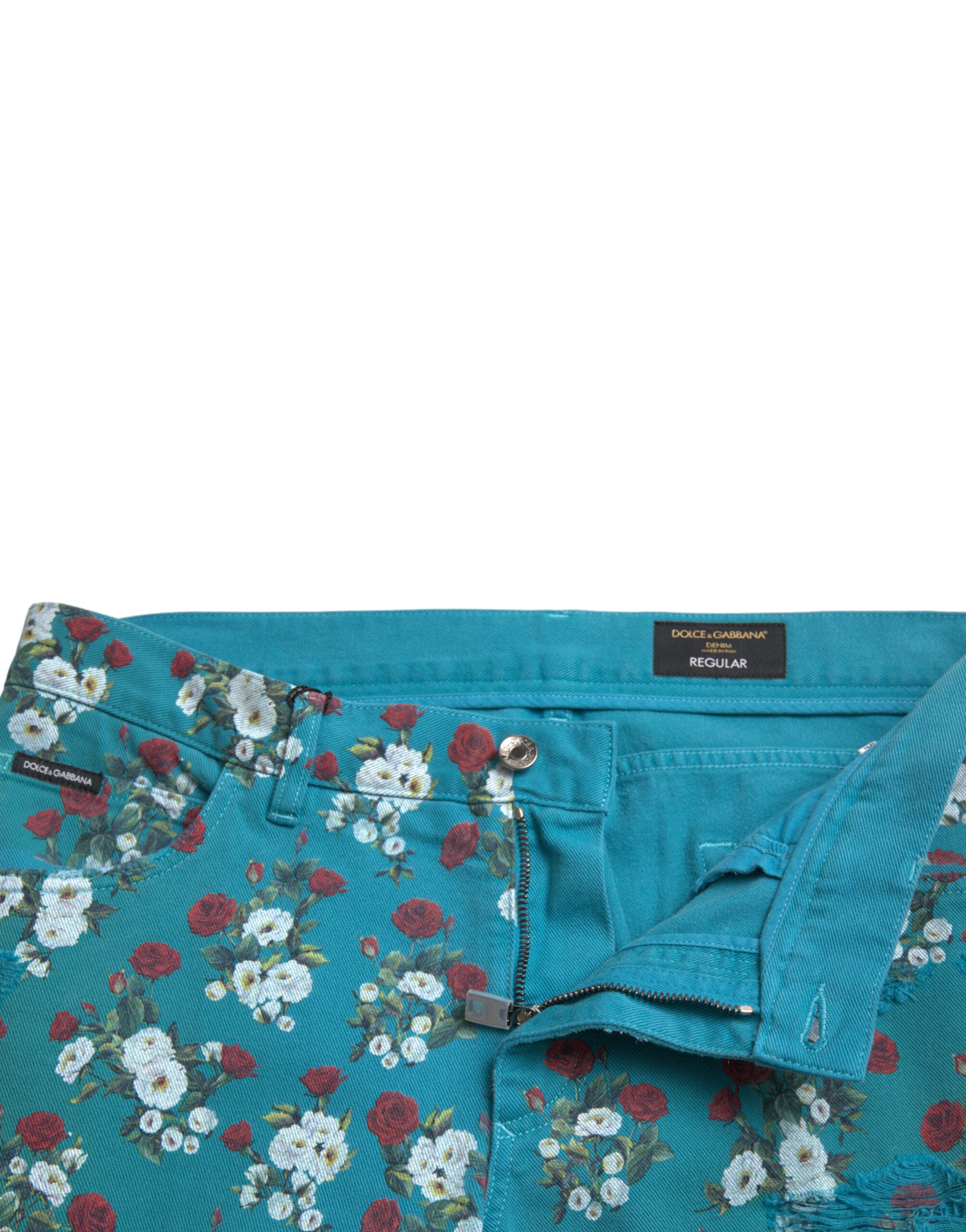 Blue floral print skinny cotton denim pants by Dolce & Gabbana, showing a close-up of the floral pattern and fitted design.
