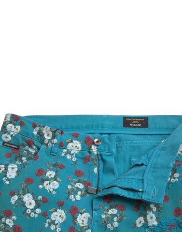 Blue floral print skinny cotton denim pants by Dolce & Gabbana, showing a close-up of the floral pattern and fitted design.
