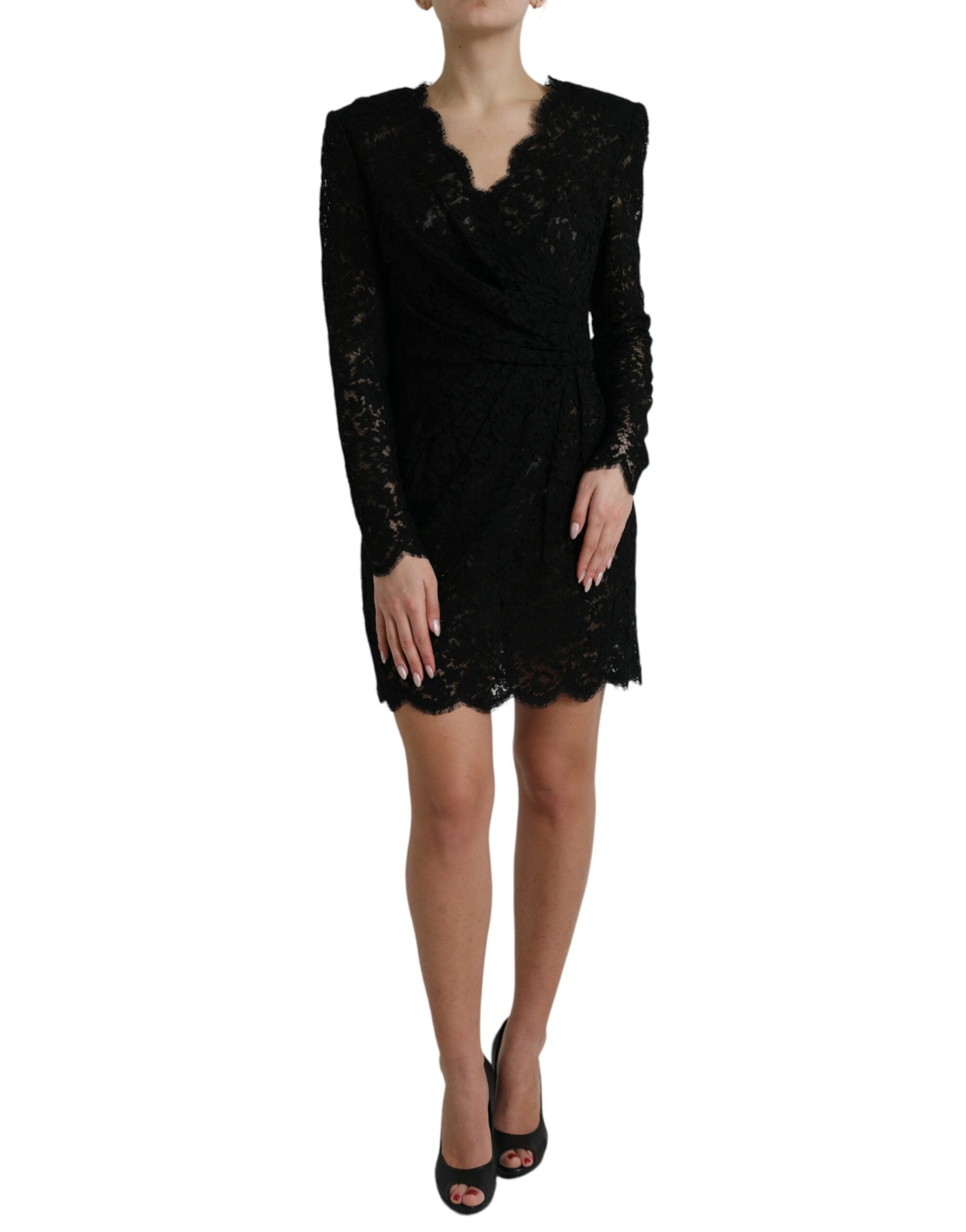 Black Dolce & Gabbana bodycon lace cotton sheath mini dress displayed on a model, showcasing its fitted silhouette and intricate lace details.