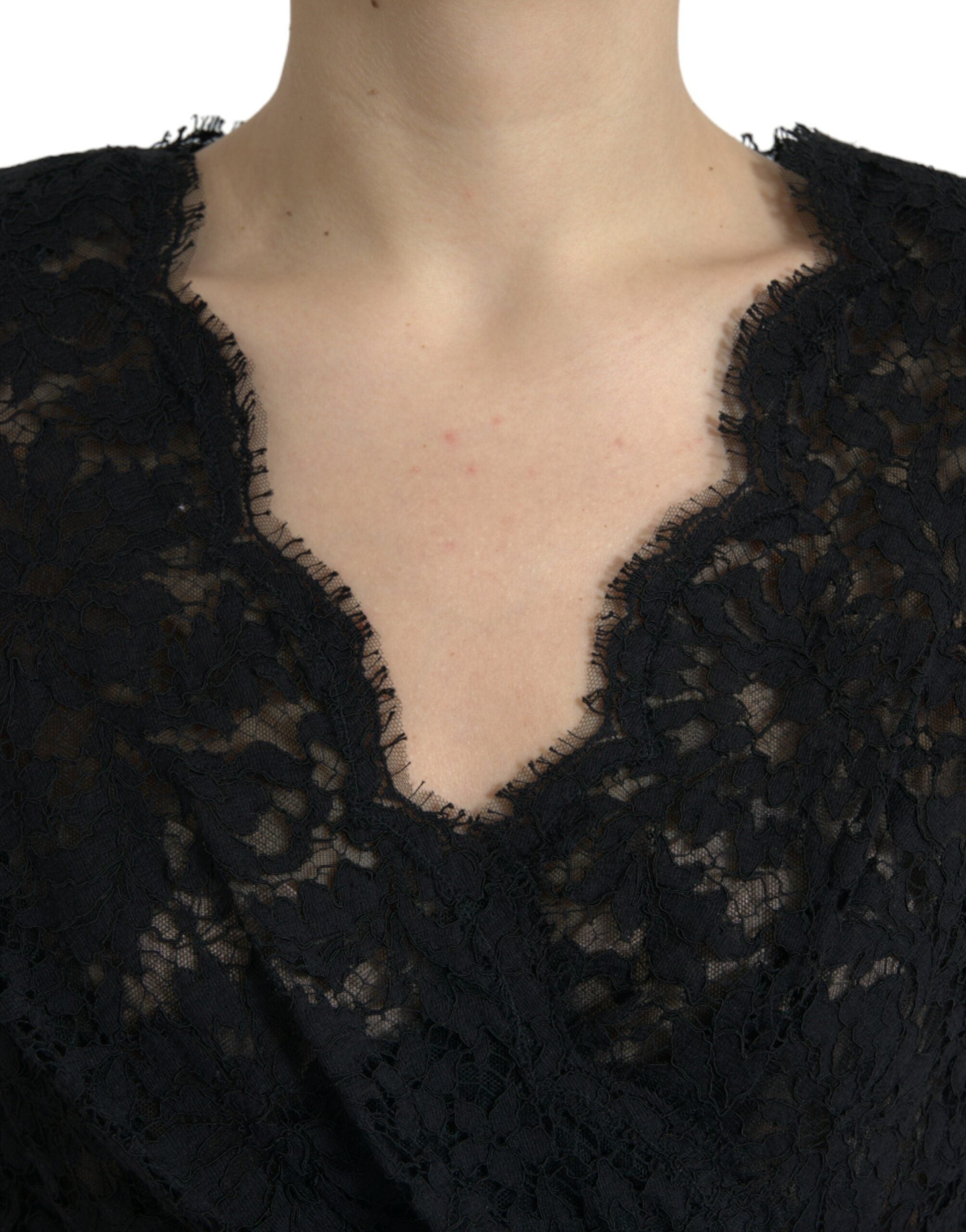 Black Dolce & Gabbana bodycon lace cotton sheath mini dress showcased on a model with fitted design and intricate lace details.
