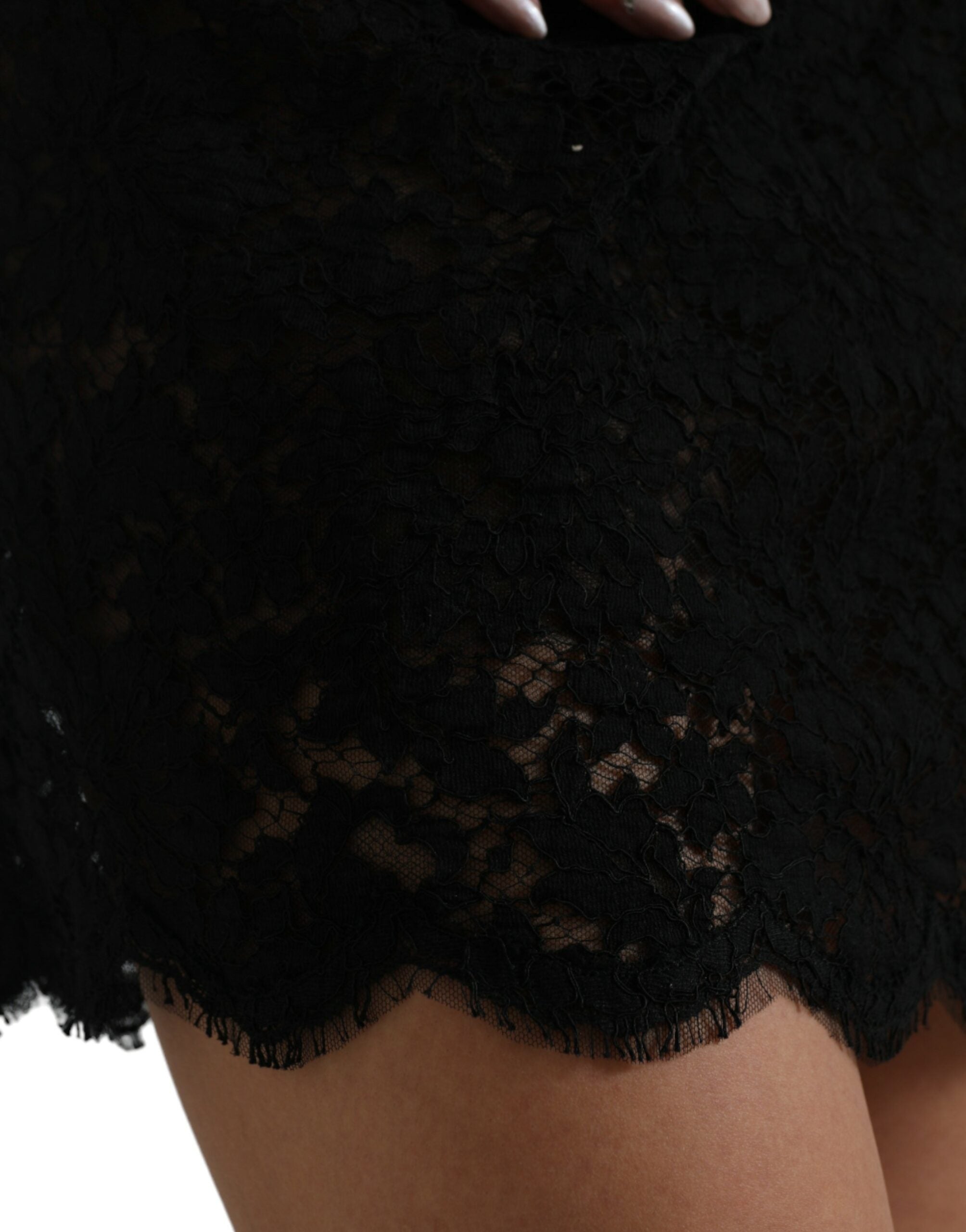 Black Dolce & Gabbana bodycon lace cotton sheath mini dress displayed on a hanger, showcasing its fitted design and intricate lace details.