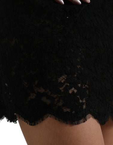 Black Dolce & Gabbana bodycon lace cotton sheath mini dress displayed on a hanger, showcasing its fitted design and intricate lace details.