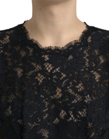 Black floral lace cotton A-line mini dress by Dolce & Gabbana with intricate lace details and a fitted silhouette.
