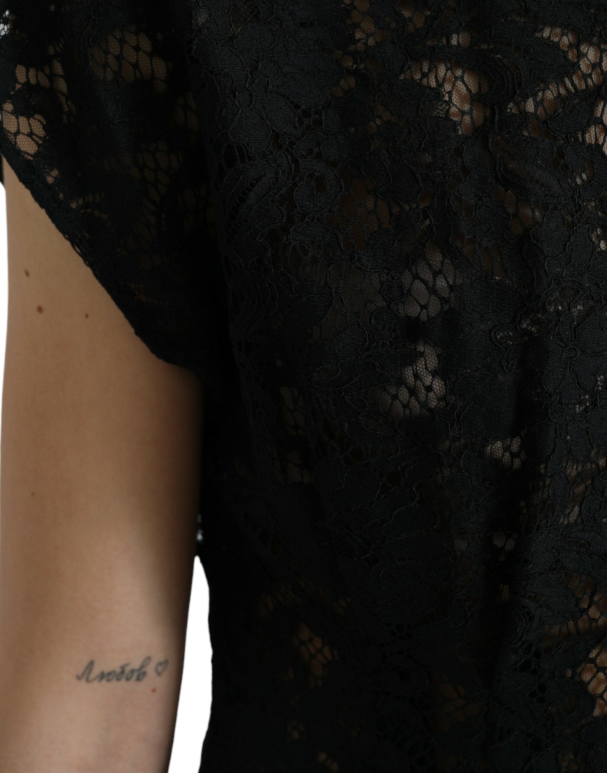 Black floral lace cotton A-line mini dress by Dolce & Gabbana, featuring delicate lace details and a fitted silhouette.