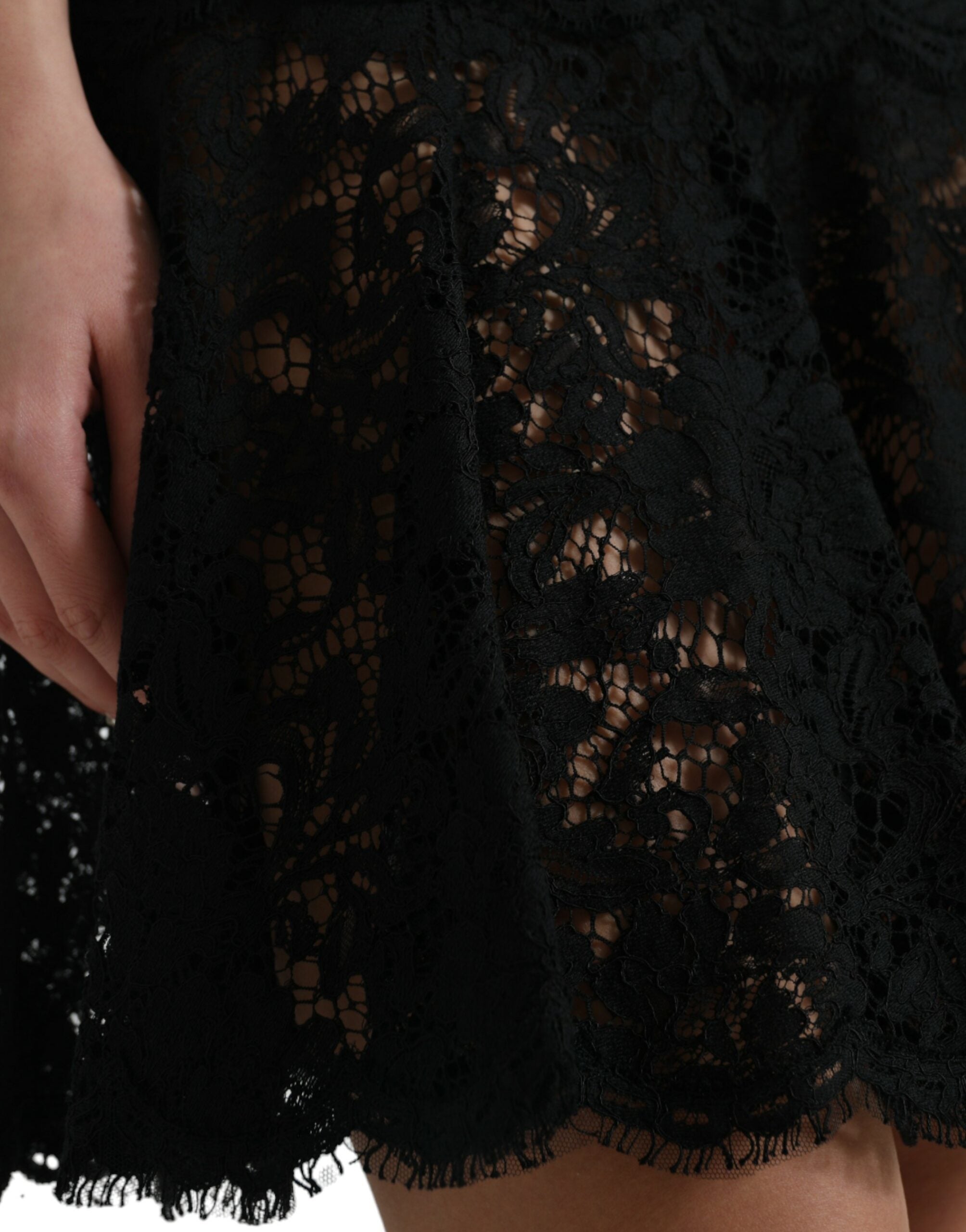 Black floral lace cotton A-line mini dress by Dolce & Gabbana, featuring intricate lace details and a flattering silhouette.
