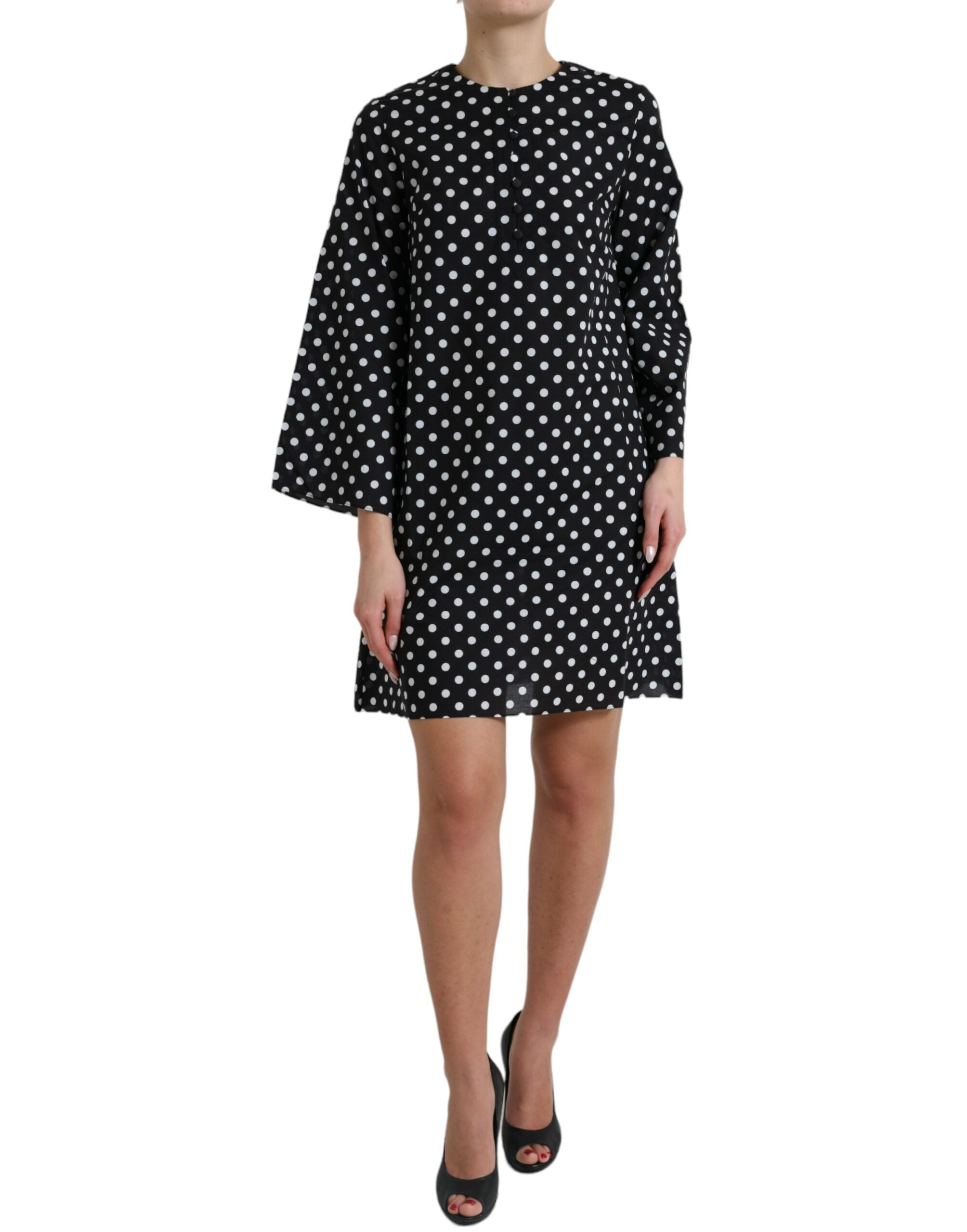Black and white polka dot nylon shift mini dress by Dolce & Gabbana, featuring a classic polka dot pattern and a sleek, fitted silhouette.
