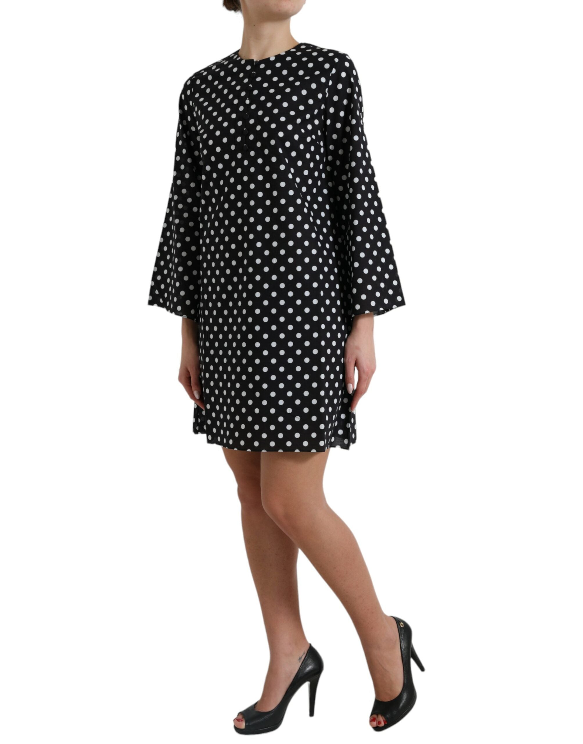 Black and white polka dot nylon shift mini dress by Dolce & Gabbana, featuring a sleeveless design and classic polka dot pattern.