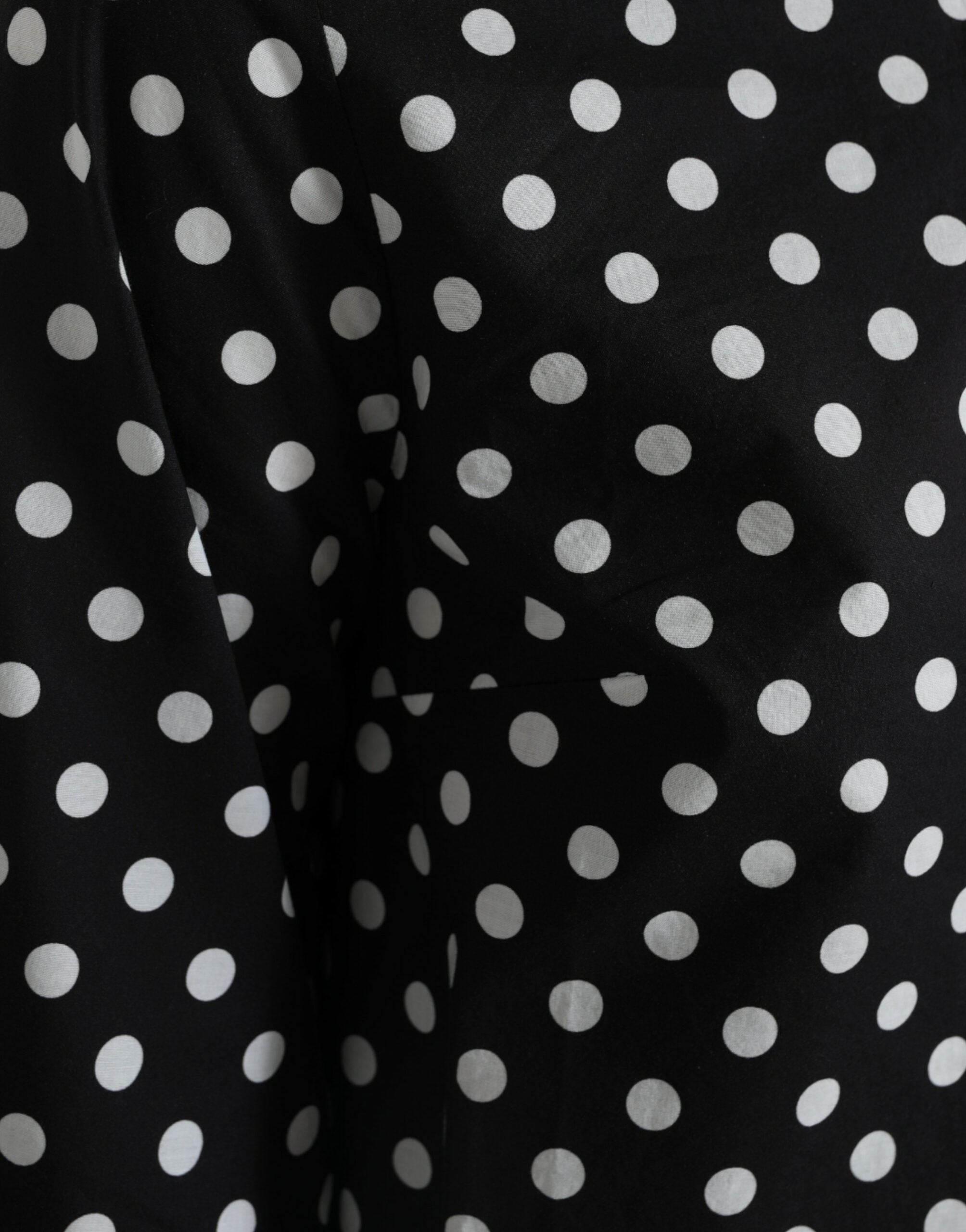 Black and white polka dot nylon shift mini dress by Dolce & Gabbana, featuring a stylish, lightweight design and classic pattern.