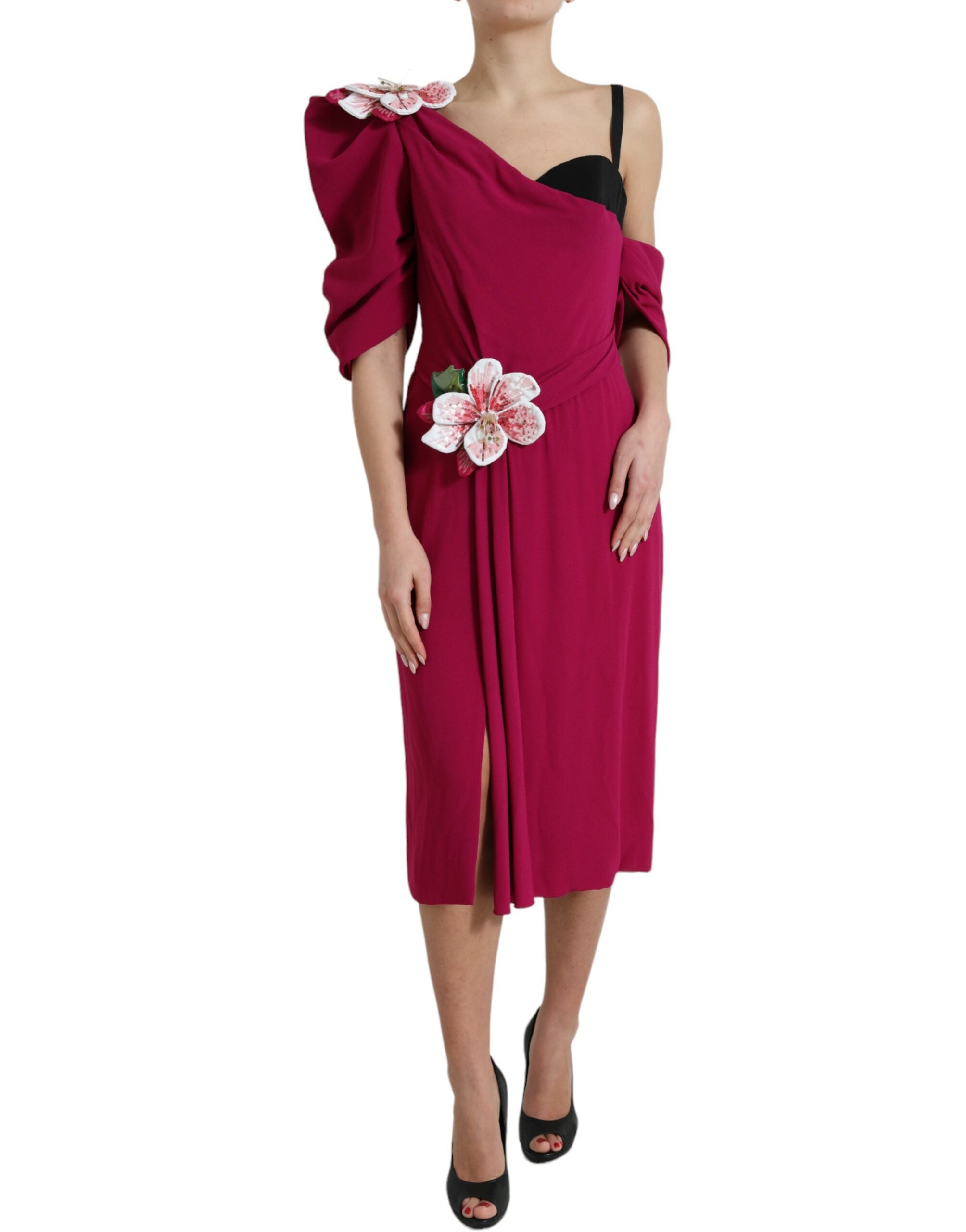 Purple flower-embellished one-shoulder dress by Dolce & Gabbana, featuring floral details and elegant design.