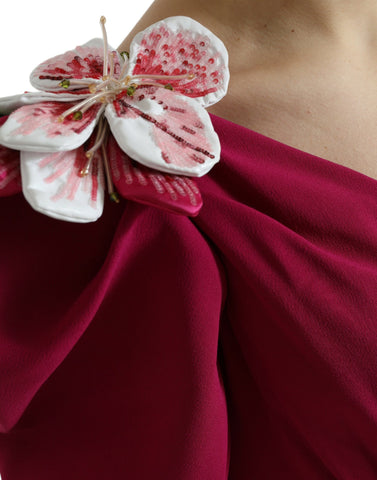 Purple one-shoulder dress by Dolce & Gabbana with floral embellishments, featuring elegant design and intricate flower details.