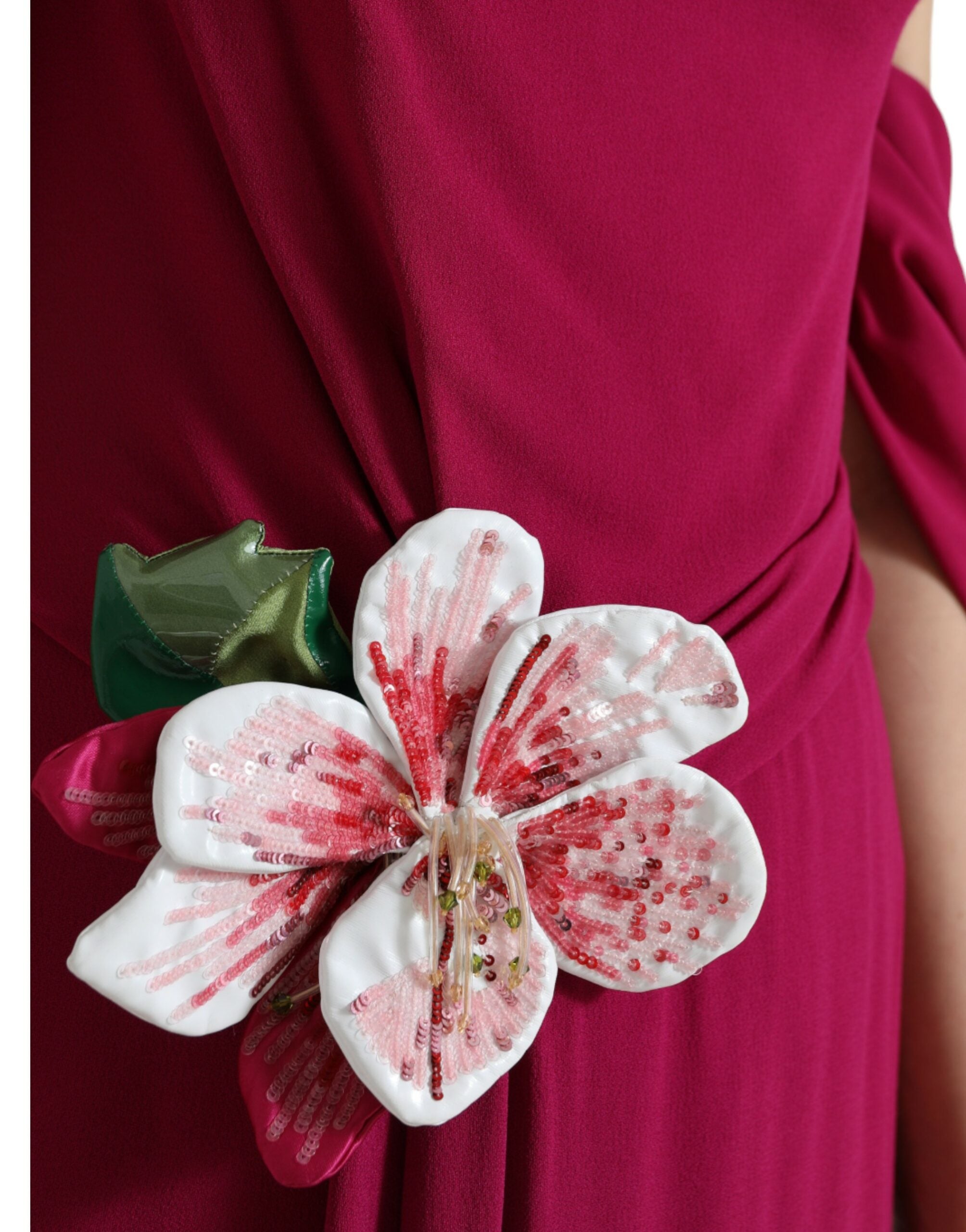 Purple flower-embellished one-shoulder dress by Dolce & Gabbana, featuring elegant floral details and a stylish silhouette.