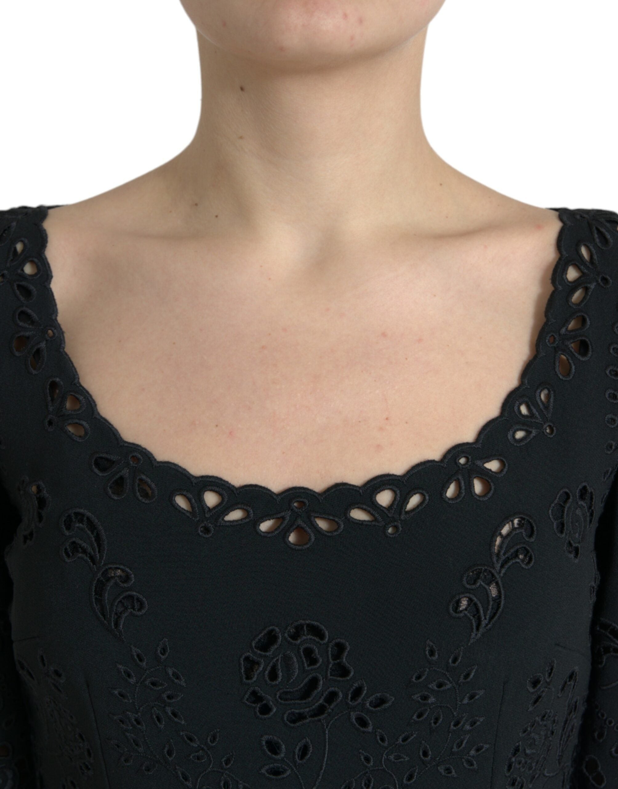Black floral lace viscose bodycon midi dress by Dolce & Gabbana displayed on a model. Elegant, fitted dress with intricate lace details.