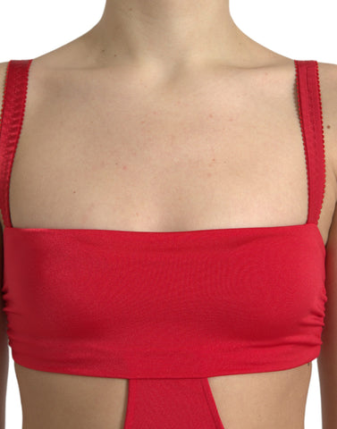 Red nylon sheath mini dress with cutout design and sleeveless style by Dolce & Gabbana, shown on a model.