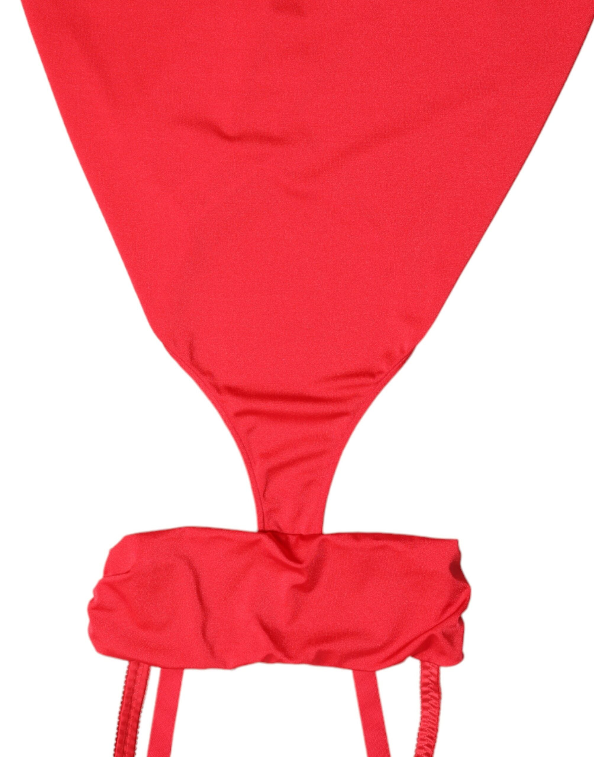 Red nylon sheath mini dress with cutout details and sleeveless design by Dolce & Gabbana, shown on a model.