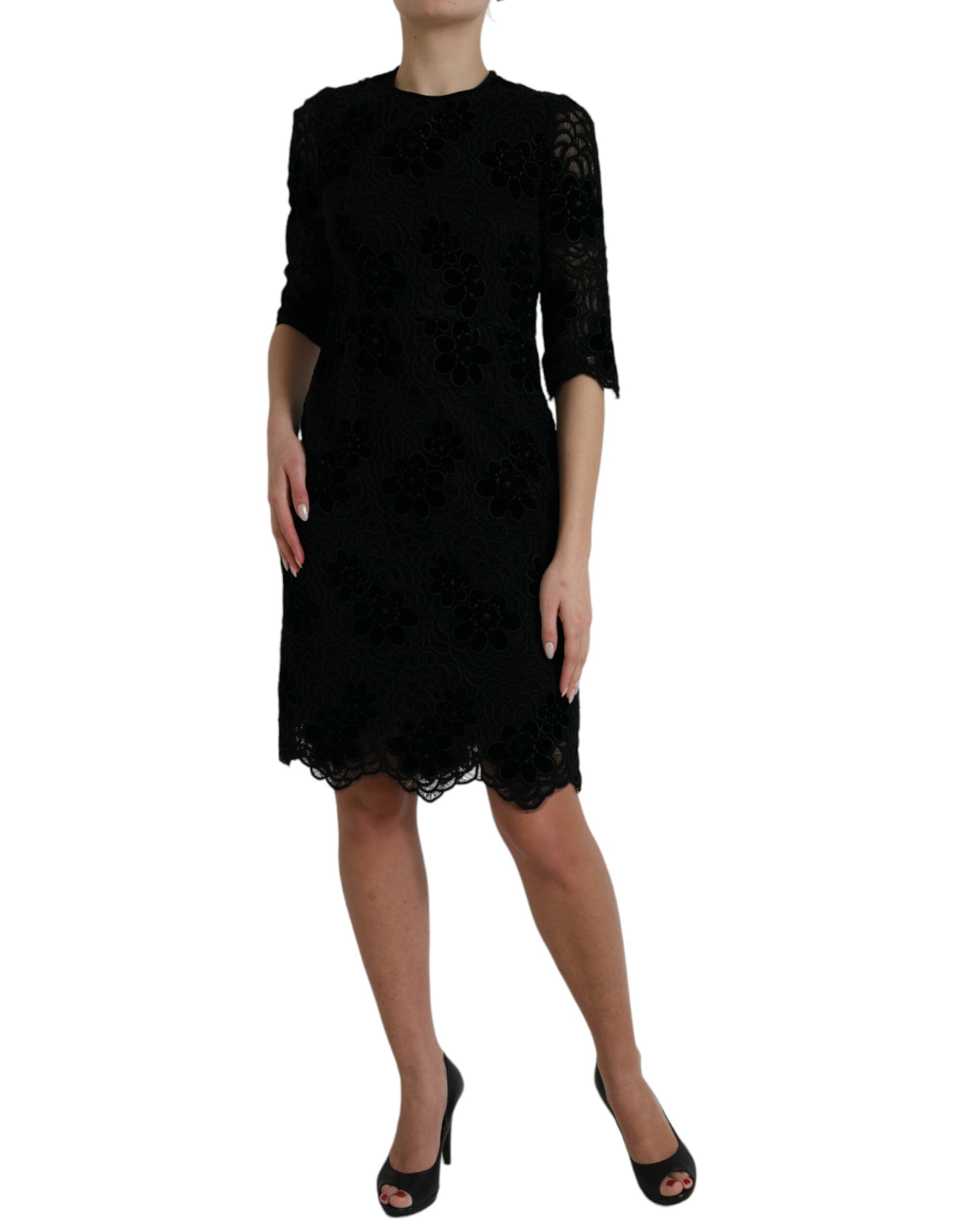 Black floral lace cotton bodycon dress by Dolce & Gabbana, fitted design with intricate lace details.