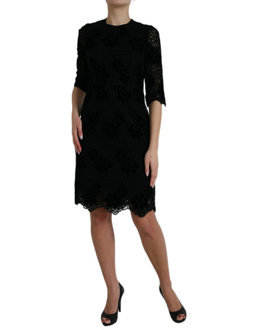 Black floral lace cotton bodycon dress by Dolce & Gabbana, fitted design with intricate lace details.