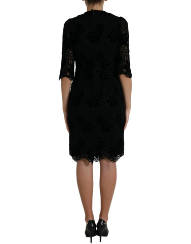 Black floral lace cotton bodycon dress by Dolce & Gabbana, featuring a fitted silhouette and elegant lace details.
