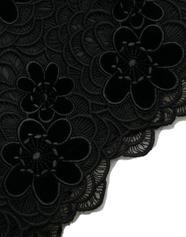 Black floral lace cotton bodycon dress by Dolce & Gabbana, showcasing fitted design with intricate lace details.